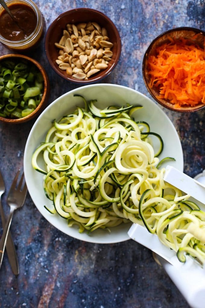 15 minute Raw Peanut Zoodle Salad with spiralized zucchini, shredded carrots and a simple peanut dressing. | Gluten Free + Vegan + Paleo Option 