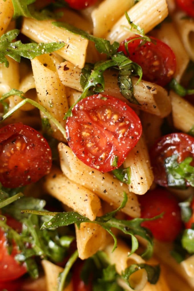 cherry tomatoes cut in half, sliced basil and cooked gluten free pasta mixed in a black pepper and balsamic vinaigrette 
