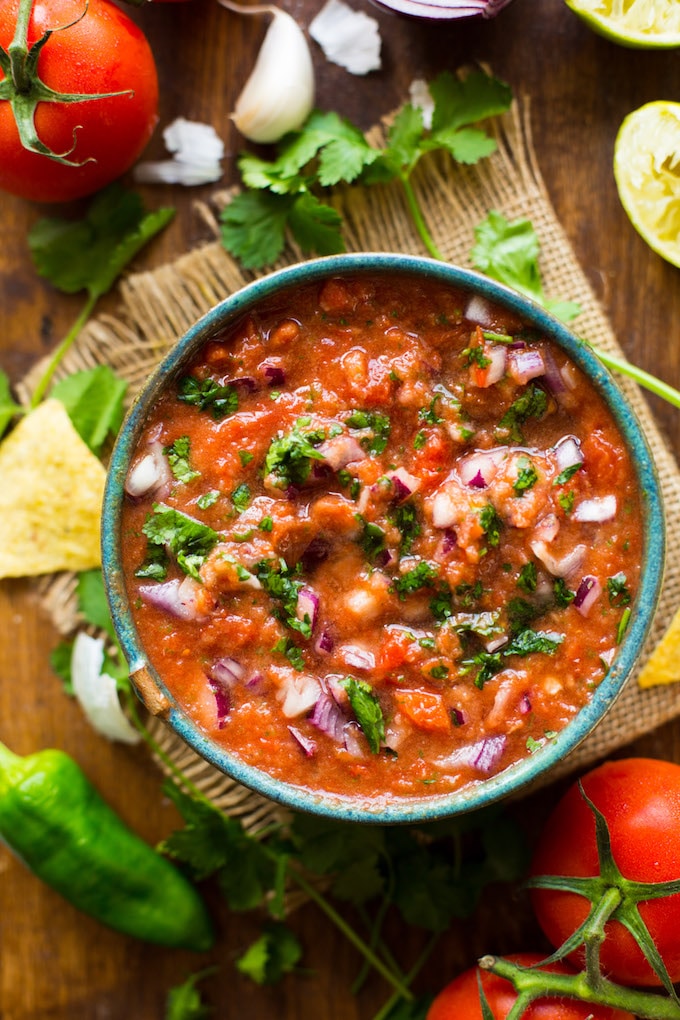 Easy 10 minute Fresh Tomato Salsa made in the blender - fresh tomatoes, cilantro, garlic, onion, jalapeño & lime blitzed together to make the perfect homemade salsa! Gluten Free + Whole30 
