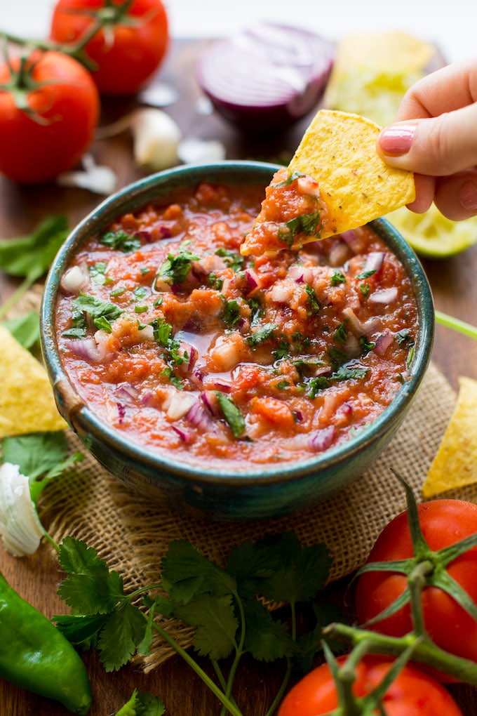 Easy 10 minute Fresh Tomato Salsa made in the blender - fresh tomatoes, cilantro, garlic, onion, jalapeño & lime blitzed together to make the perfect homemade salsa! Gluten Free + Whole30 