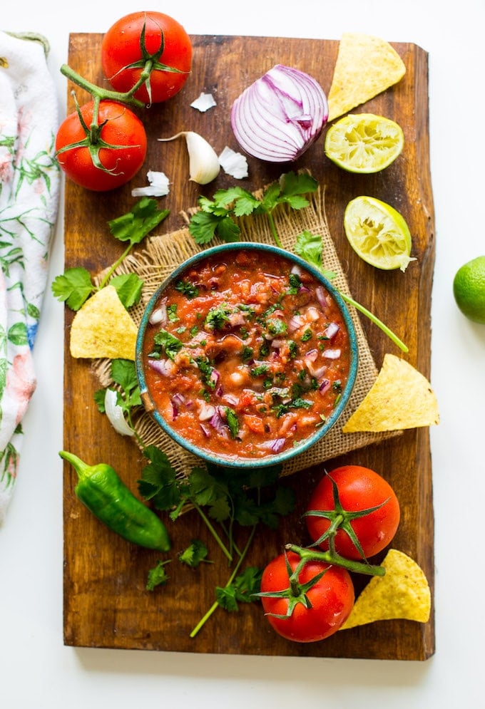 Easy 10 minute Fresh Tomato Salsa made in the blender - fresh tomatoes, cilantro, garlic, onion, jalapeño & lime blitzed together to make the perfect homemade salsa! Gluten Free + Whole30 