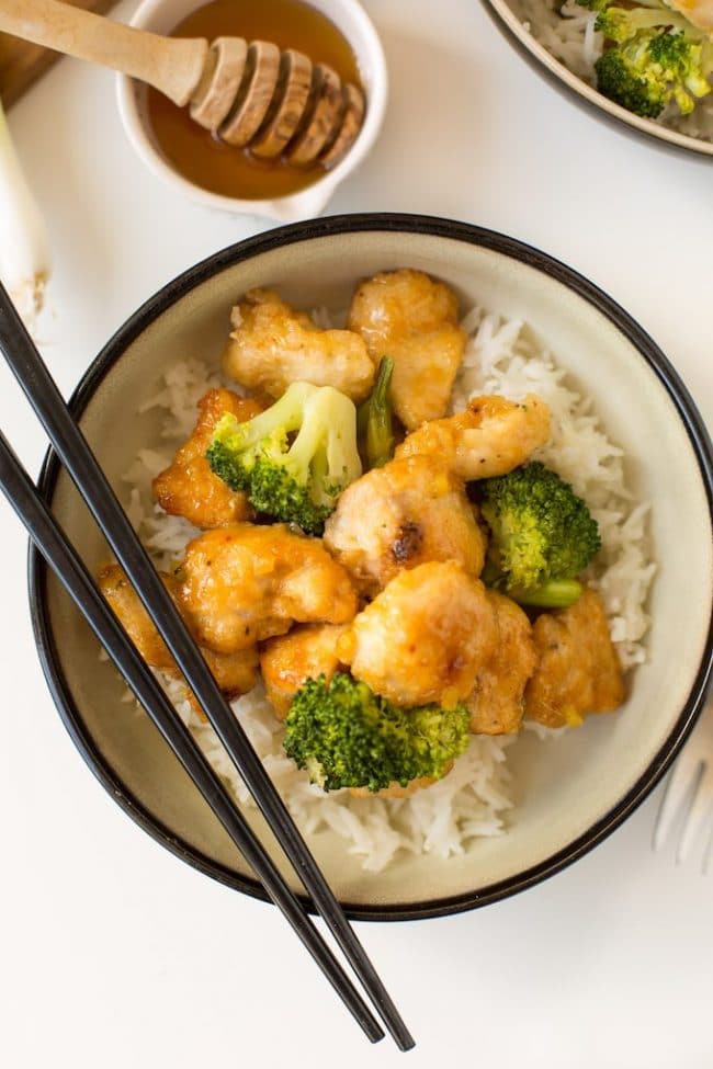 Ginger Honey Chicken in a bowl with broccoli and rice