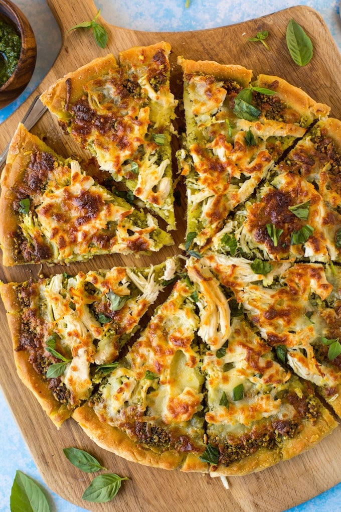 Low FODMAP Chicken Pesto Pizza - topped with a simple chive pesto, shredded chicken breasts and mozzarella. | Gluten Free + FODMAP Friendly