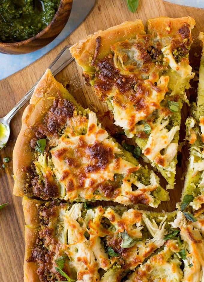 Low FODMAP Chicken Pesto Pizza - topped with a simple chive pesto, shredded chicken breasts and mozzarella. | Gluten Free + FODMAP Friendly