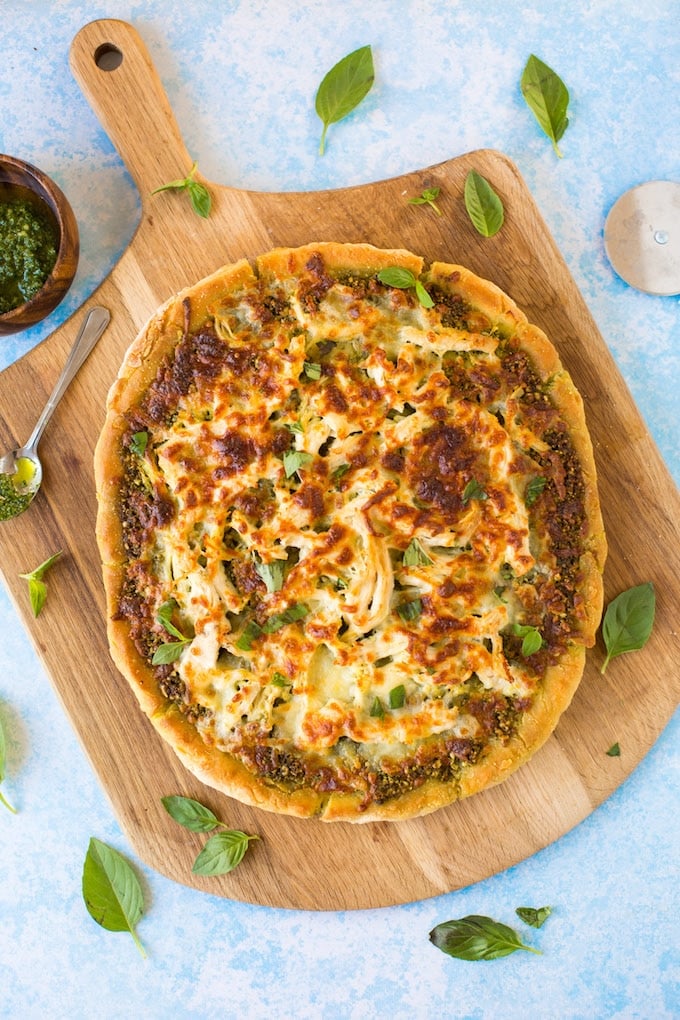 Low FODMAP Chicken Pesto Pizza - topped with a simple chive pesto, shredded chicken breasts and mozzarella. | Gluten Free + FODMAP Friendly