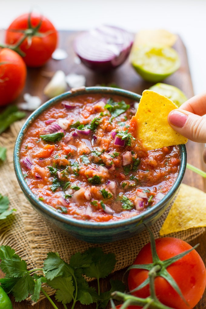 Easy 10 minute Fresh Tomato Salsa made in the blender - fresh tomatoes, cilantro, garlic, onion, jalapeño & lime blitzed together to make the perfect homemade salsa! Gluten Free + Whole30 