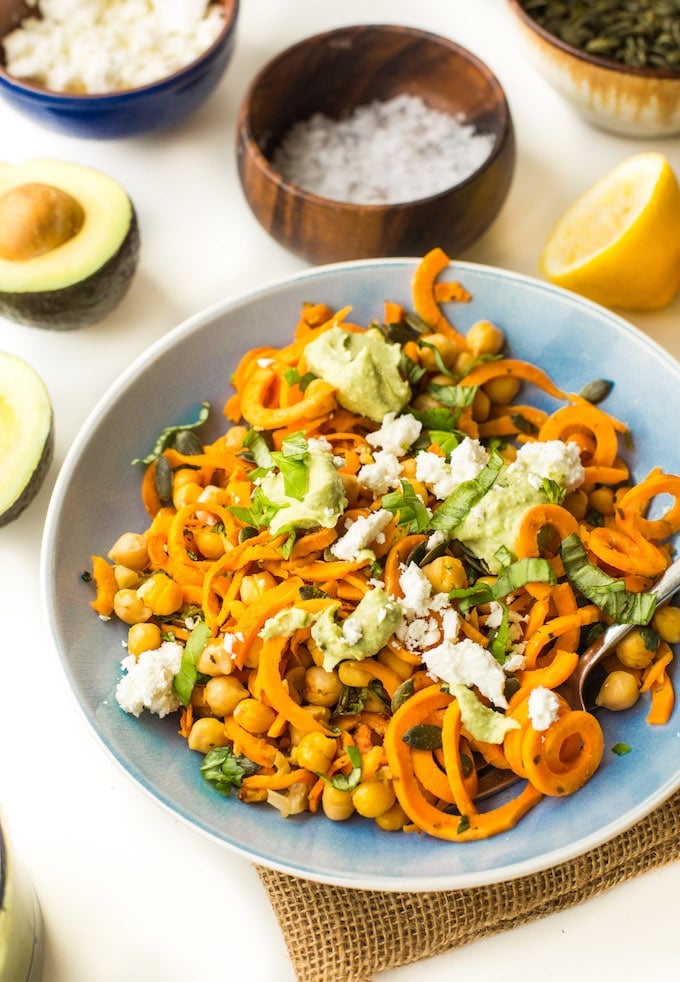 Spiralized Sweet Potato Noodles tossed in simple avocado tahini sauce, mixed with chickpeas, fresh basil and top with feta | Gluten Free + Grain Free + Vegan Option