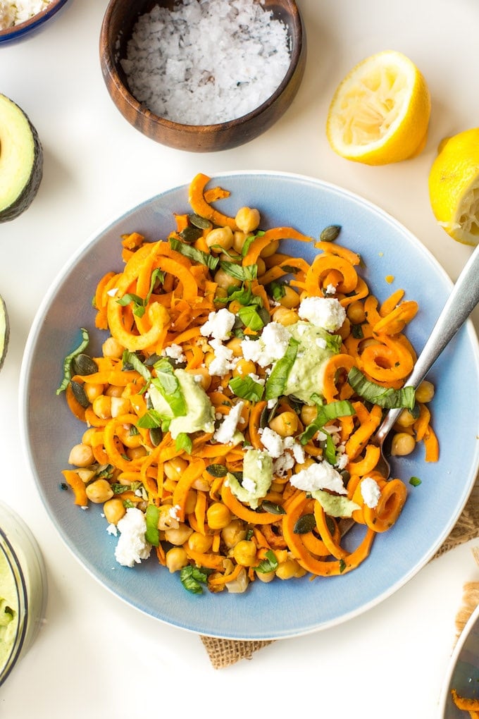 Spiralized Sweet Potato Noodles tossed in simple avocado tahini sauce, mixed with chickpeas, fresh basil and top with feta | Gluten Free + Grain Free + Vegan Option