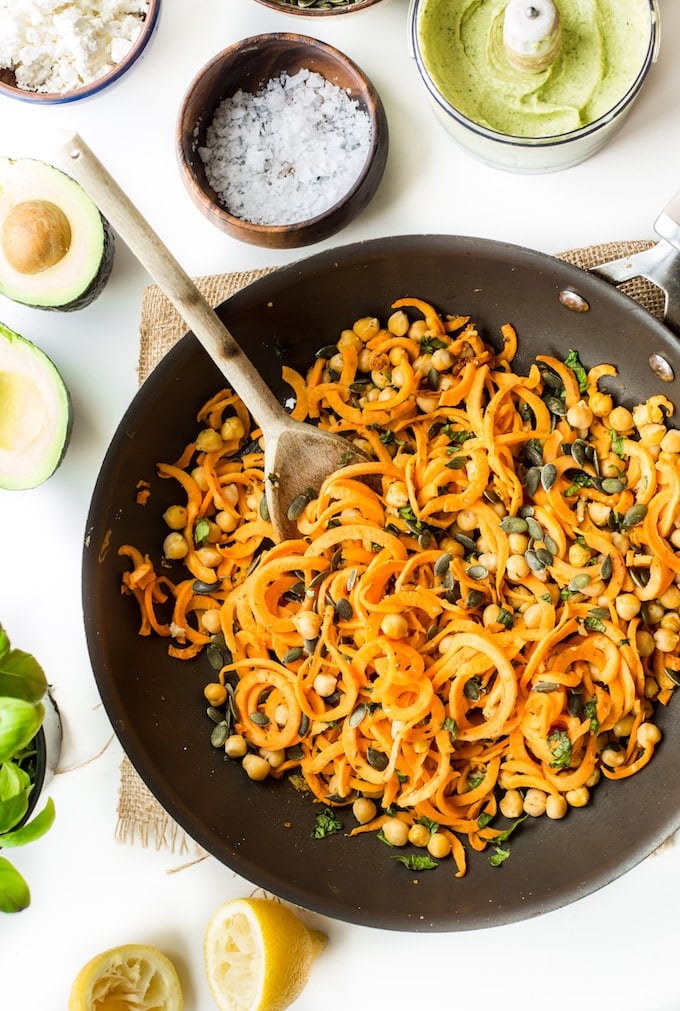 Spiralized Sweet Potato Noodles tossed in simple avocado tahini sauce, mixed with chickpeas, fresh basil and top with feta | Gluten Free + Grain Free + Vegan Option