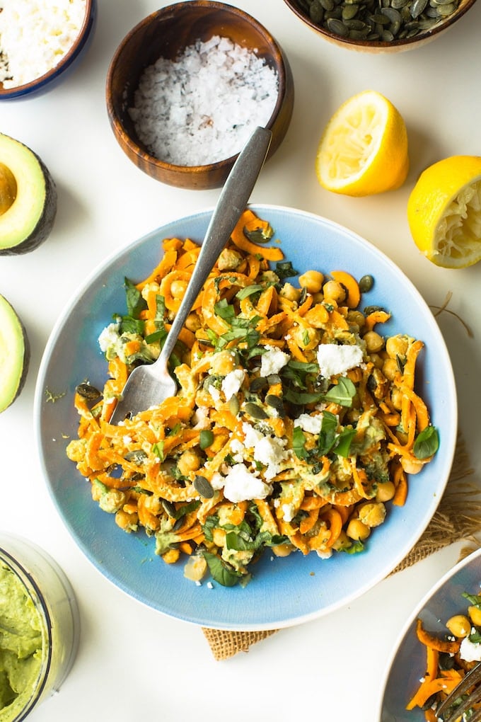 Spiralized Sweet Potato Noodles tossed in simple avocado tahini sauce, mixed with chickpeas, fresh basil and top with feta | Gluten Free + Grain Free + Vegan Option