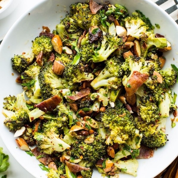 Garlic & Chili Roasted Broccoli Salad in a bowl on a stripped napkin
