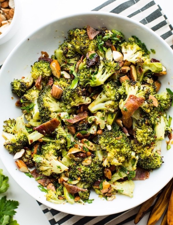 Garlic & Chili Roasted Broccoli Salad in a bowl on a stripped napkin