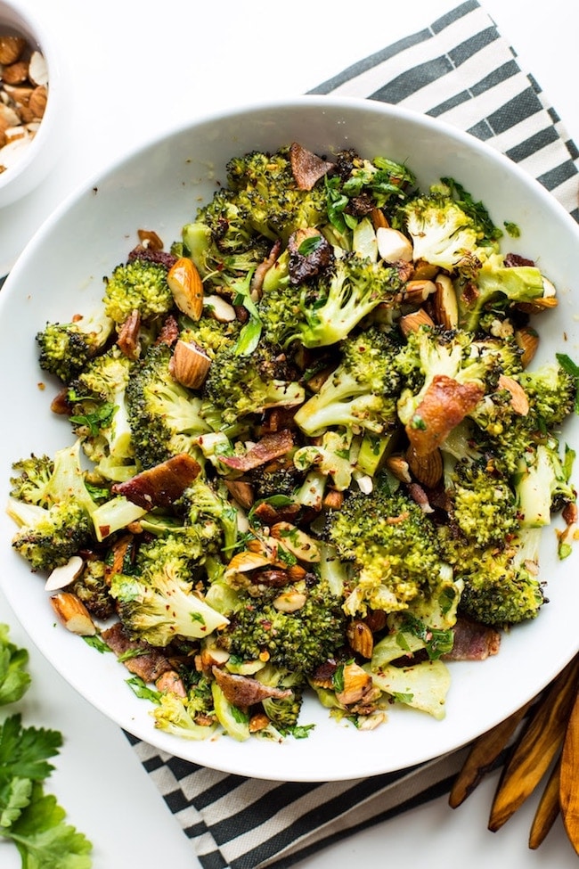 Garlic & Chili Roasted Broccoli Salad in a bowl on a stripped napkin