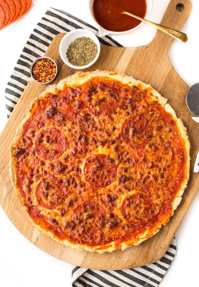 Super easy gluten free thin crust pizza - only six ingredients in the crust and no rise or yeast required! Ready in under 30 minutes! Gluten free + Grain Free