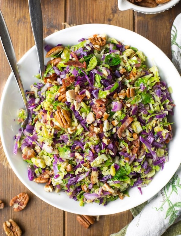 Bacon Brussels & Cabbage Salad in a serving bowl with tongs