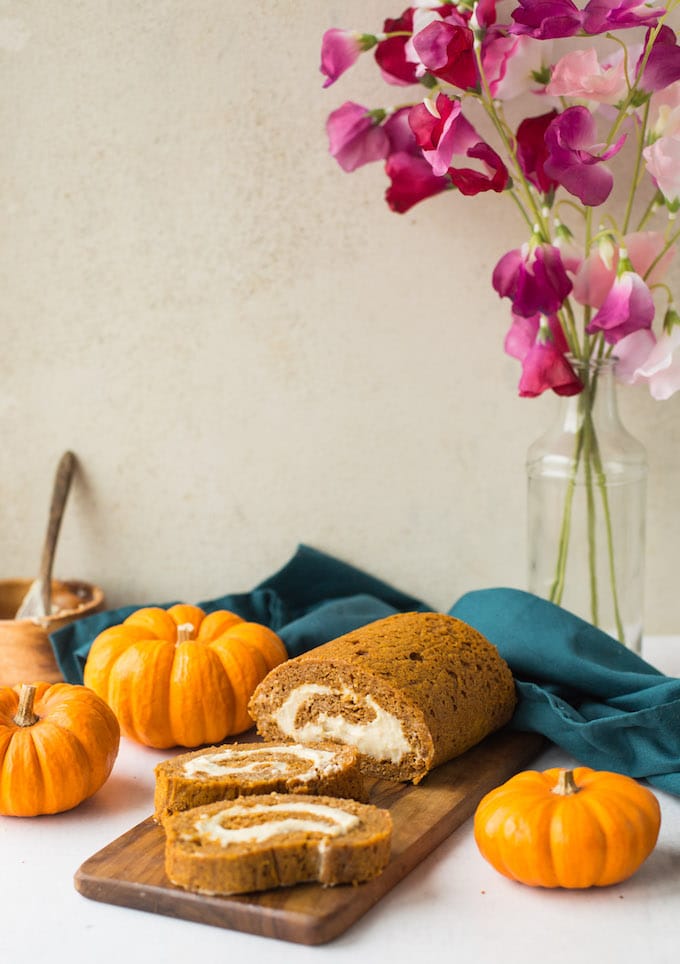 Tender, moist and flavourful Paleo Pumpkin Roll - a light and fluffy almond based cake filled with a simple cashew cream! | Gluten Free + Dairy Free | Sliced cake 