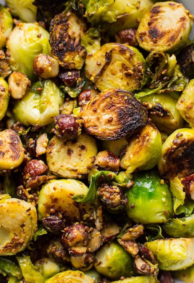 up close of sauteed brussels sprouts with hazelnuts and mustard 