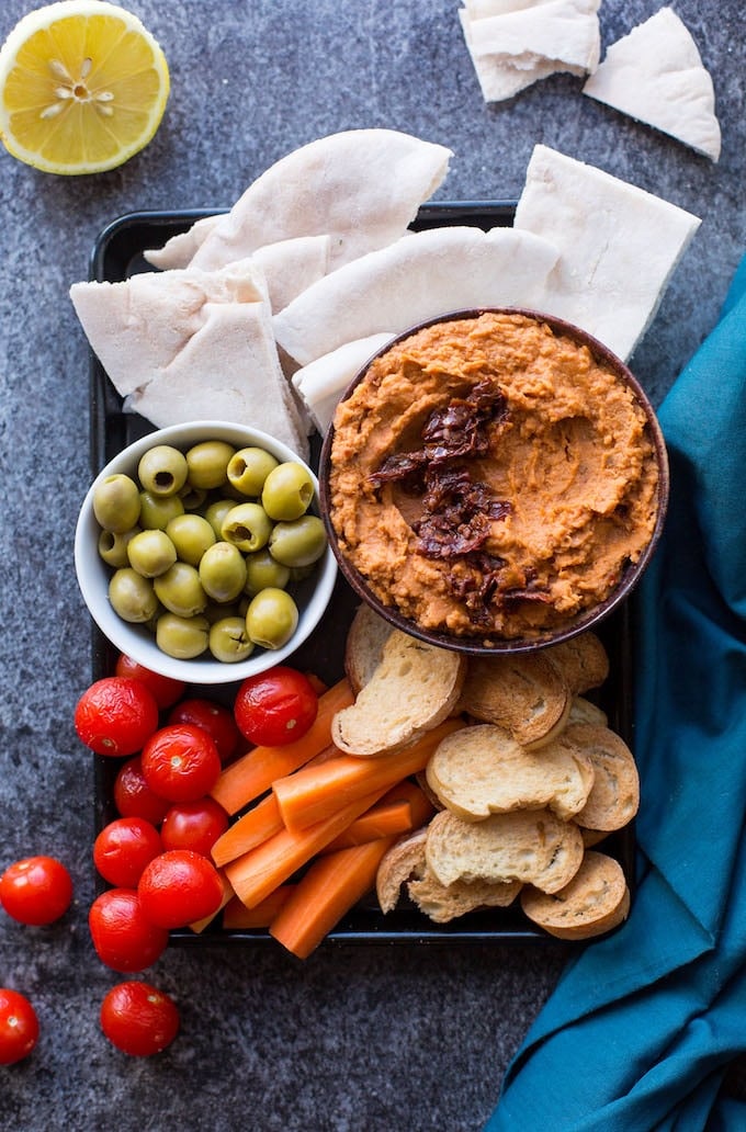 5-minute Sun Dried Tomato White Bean Dip - smooth, creamy, and packed full of flavour! | Gluten Free + Vegan | Overhead view - dip in tray with veggies and bread