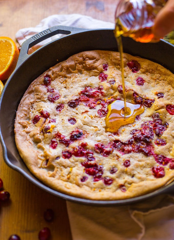 Grain free Cranberry Orange Dutch Baby - sweet, tangy, and perfectly spiced! Perfect for holiday breakfasts & brunches | Dairy Free + Refined Sugar Free