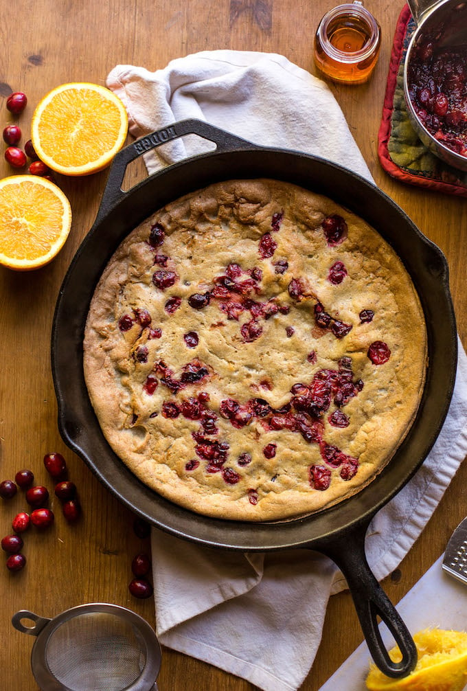 Grain free Cranberry Orange Dutch Baby - sweet, tangy, and perfectly spiced! Perfect for holiday breakfasts & brunches | Dairy Free + Refined Sugar Free