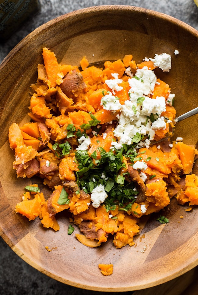  Sweet Potato Mash in a bowl topped with feta and cilantro 