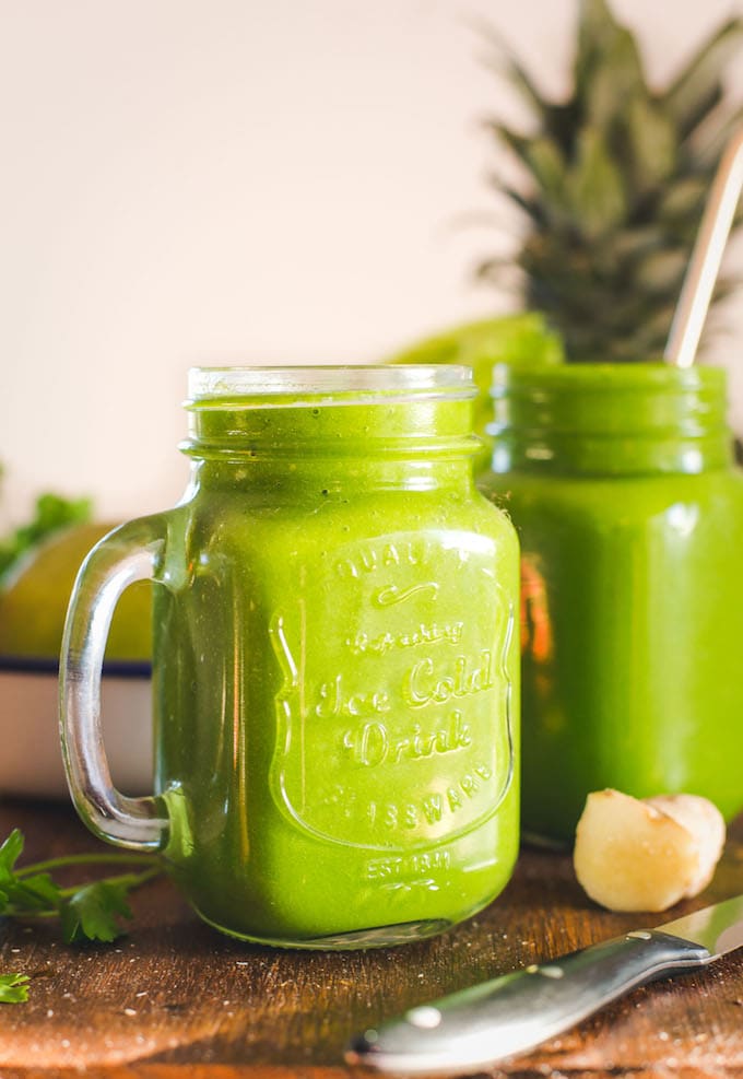 Green Monster Smoothie - loaded with anti inflammatory fruits and vegetables, herbs & spices. Enjoy as a starter to your morning or when you need a pick-me-up throughout the day! Paleo + Vegan - up close view