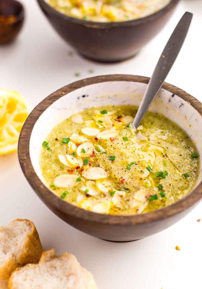 bowl of Broccoli Leek Soup with lemon and slice of bread