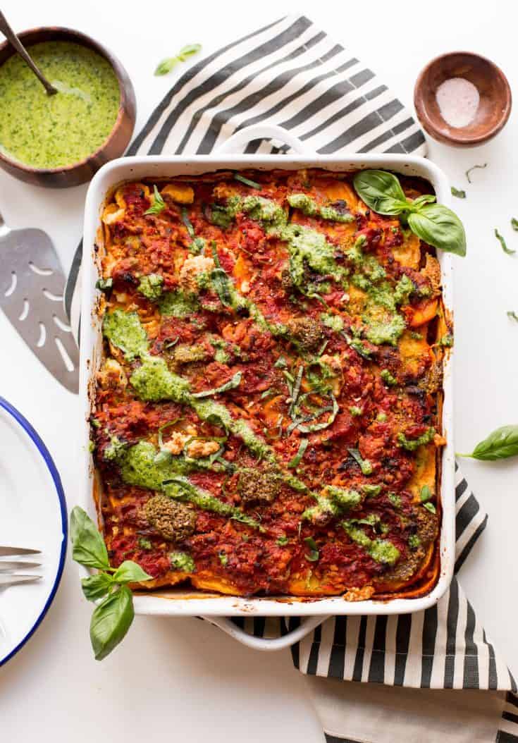 sweet potato lasagna topped with pesto and basil