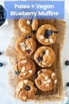 Paleo Vegan Blueberry Muffins on a wooden board and topped with flaked almonds