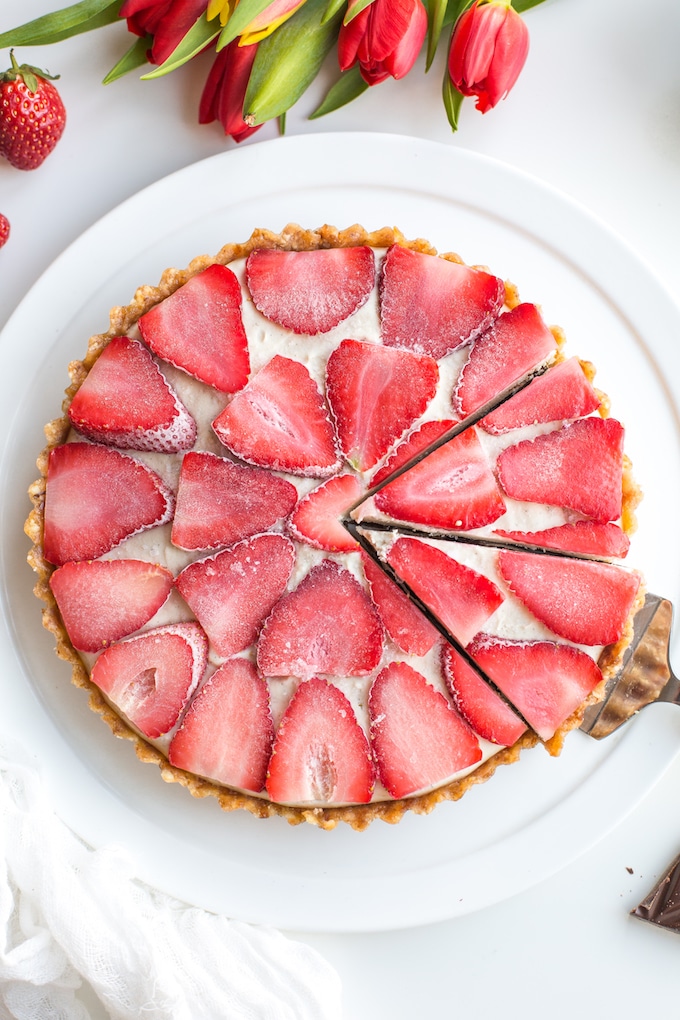 Strawberry Vanilla Vegan Cheesecake slices with tulips