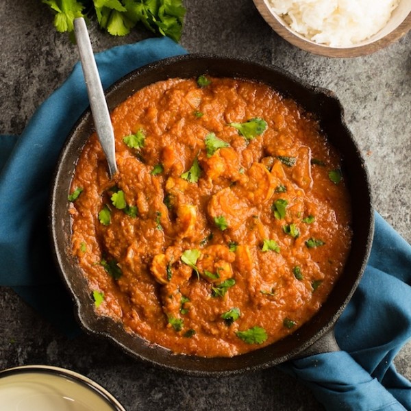 tomato shrimp curry in a cast iron skillet