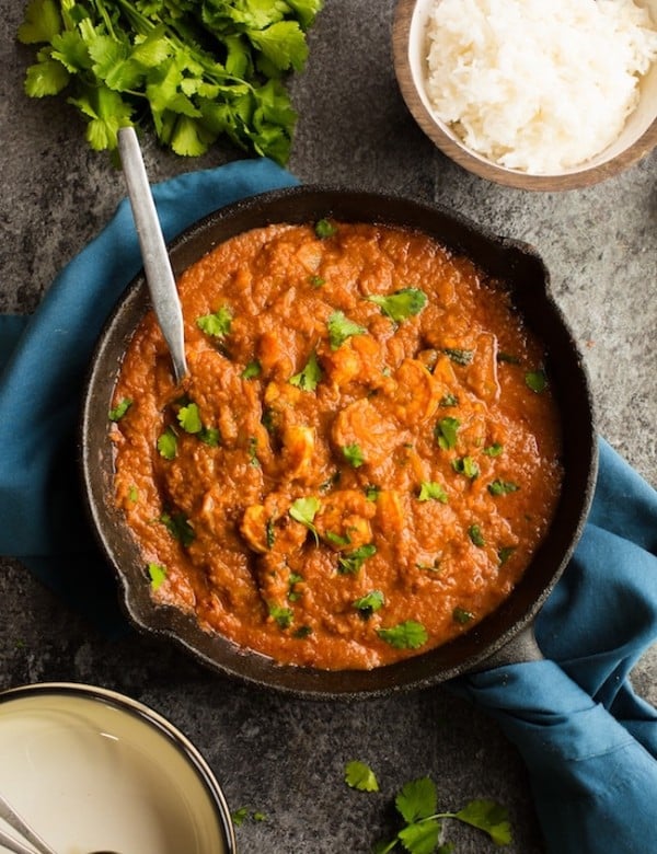 tomato shrimp curry in a cast iron skillet