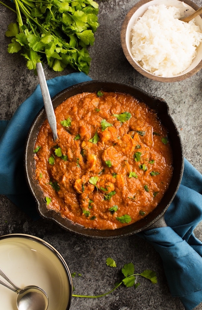 tomato shrimp curry in a cast iron skillet
