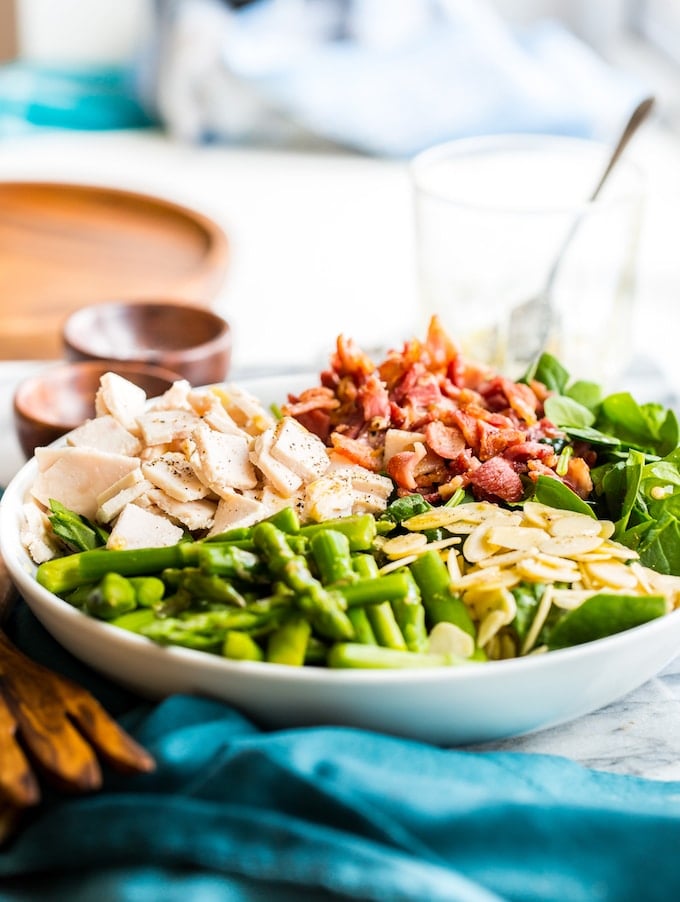 Chicken Bacon Spinach and Asparagus Salad with slivered almonds in a bowl #GlutenFree + #Paleo + #Whole30 + #SpringSalad