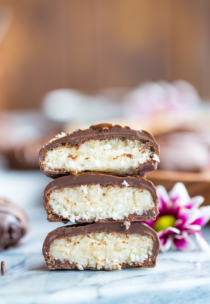 Paleo Peppermint Patties cut in half with the coconut centre revealed