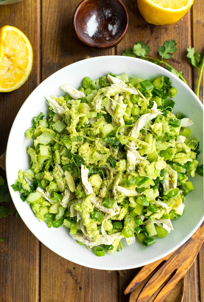 Avocado Chicken Salad in a bowl with squeezed lemon and cilantro