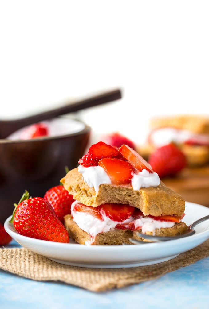 Gluten Free Vegan Strawberry Shortcake with coconut whipped cream and fresh berries presented on a plate