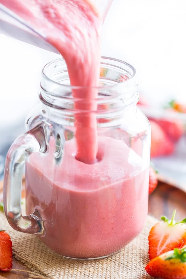 Healthy Strawberry Shake pouring into a glass