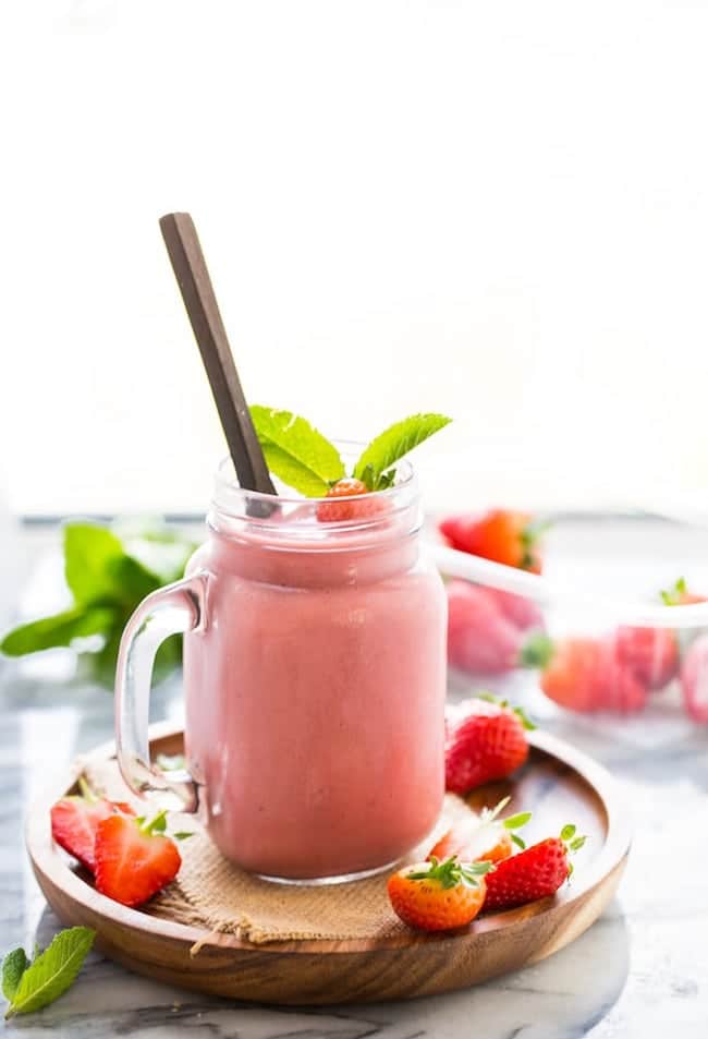 Healthy Strawberry Shake garnished with mint and fresh strawberries