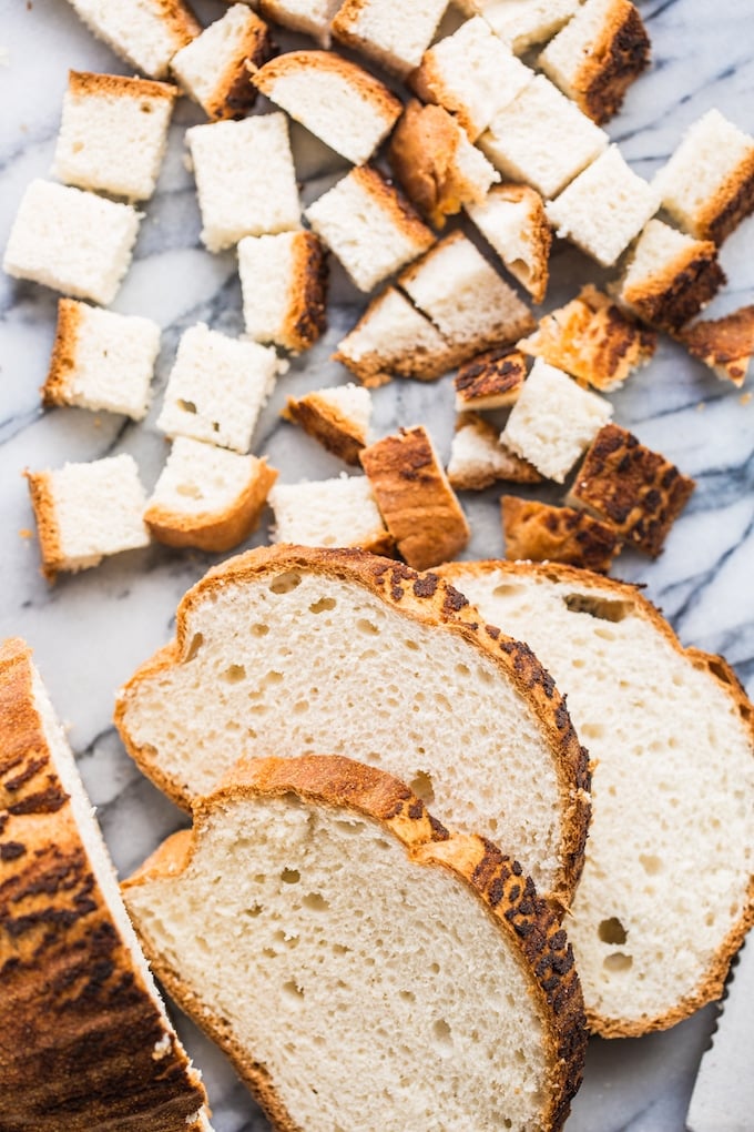 gluten free bread cut into bread chunks before turning into croutons