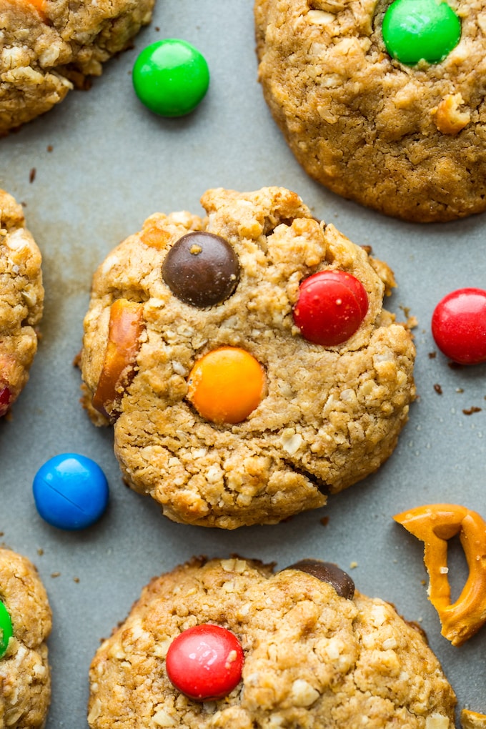 Gluten Free Monster Cookies with m&m's and pretzels on a baking sheet