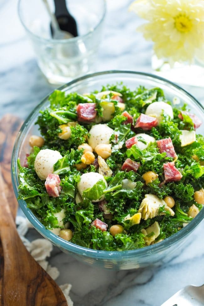 Chickpea Kale Antipasto Salad in a salad bowl on a marble counter