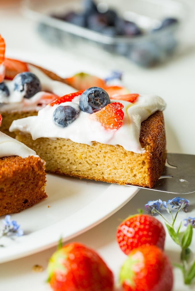 a spatula picking up a slice of Coconut Flour Cake