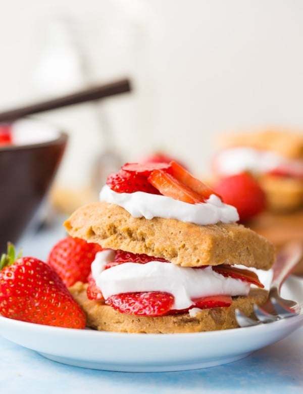 Gluten Free Vegan Strawberry Shortcake with coconut whipped cream and fresh berries presented on a plate