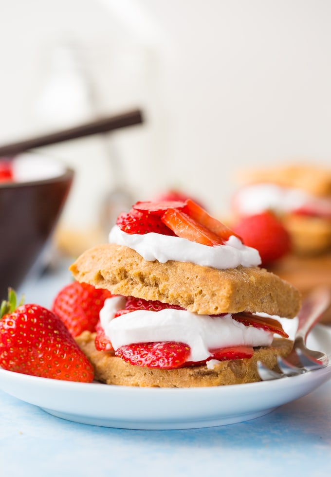 Gluten Free Vegan Strawberry Shortcake with coconut whipped cream and fresh berries presented on a plate