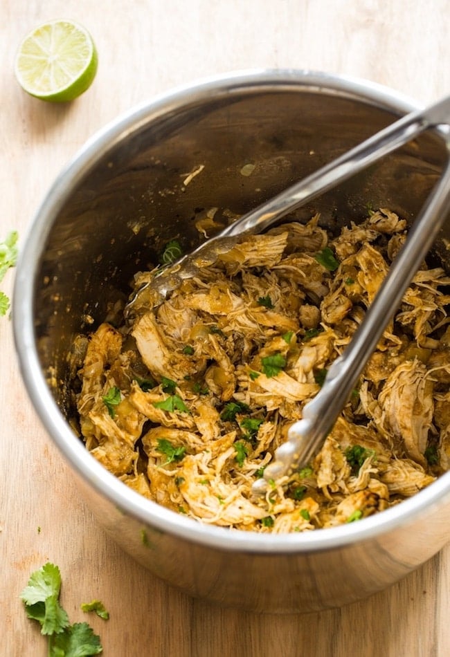 Instant Pot Chicken Carnitas - shredded chicken in the instant pot topped with fresh cilantro