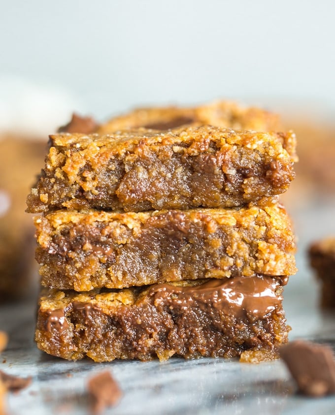 Paleo Almond Butter vegan Blondies stacked on top of each other