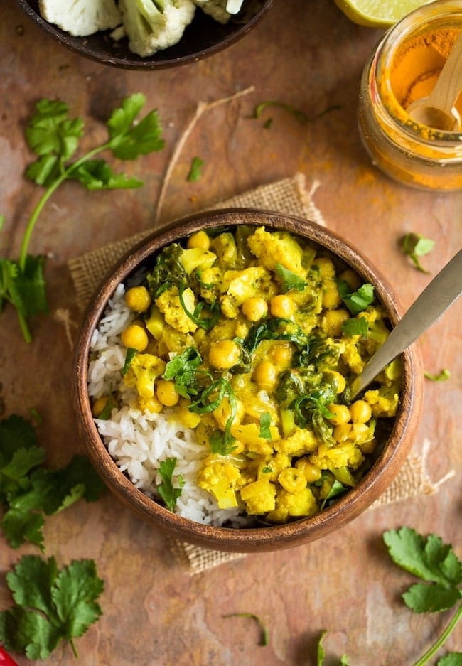 yellow cauliflower curry topped with cilantro 