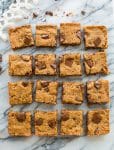 Paleo Vegan Blondies cut into squares on a marble counter