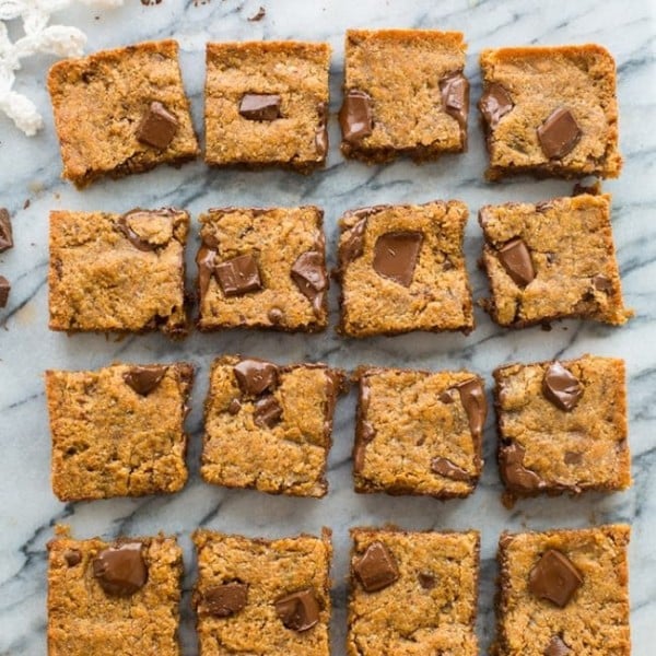 Paleo Vegan Blondies cut into squares on a marble counter